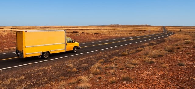 Yellow moving truck in the desert